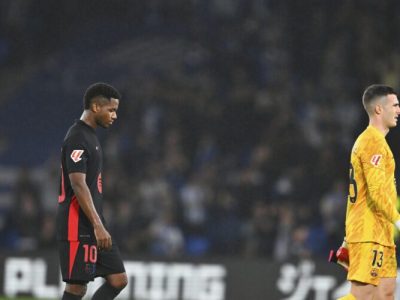 Barcelona's Ansu Fati, left, and goalkeeper Inaki Pena react after the Spanish La Liga soccer match between Real Sociedad and Barcelona at the Anoeta stadium, in San Sebastian, Spain, Sunday, Nov. 10, 2024. (AP Photo/Miguel Oses)